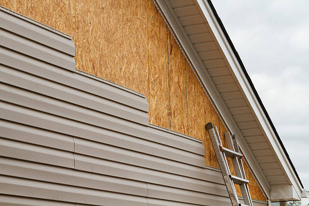 Professional Emergency Siding Repair technician working in Wind Ridge, PA